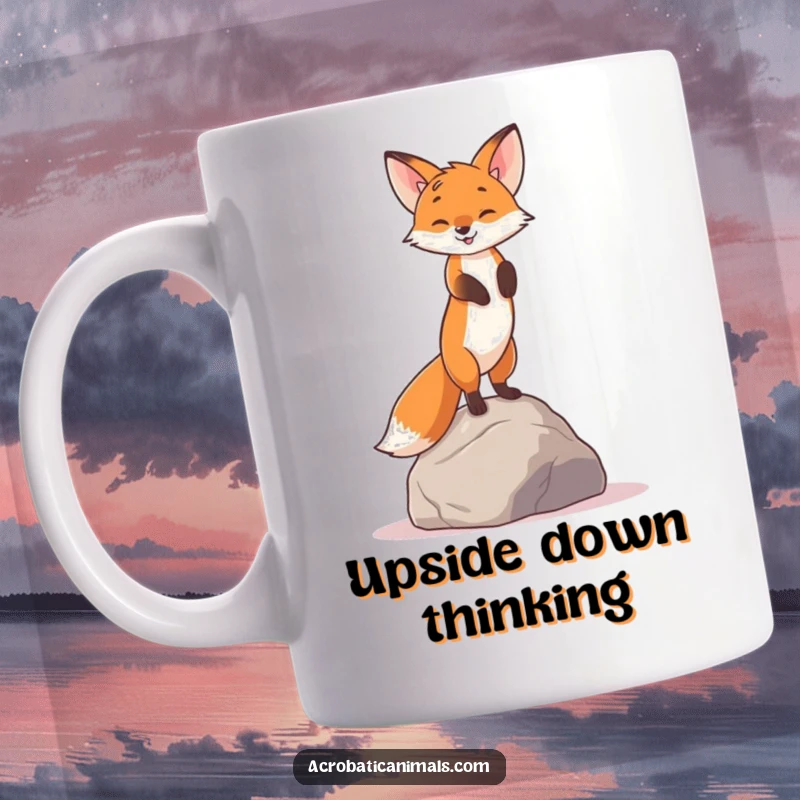 Funny mug shows a curious fox balancing in a handstand on a rock, showcasing quirky determination and agility.