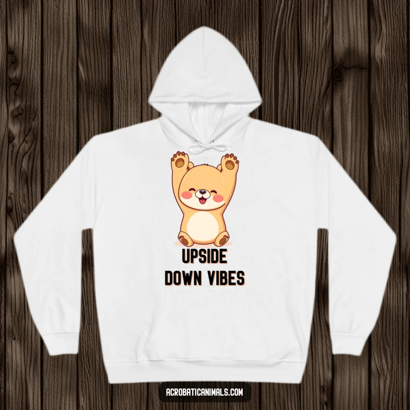 Funny bear hoodie showing a happy bear in a perfect handstand with paws up, ideal for cozy, humorous vibes.