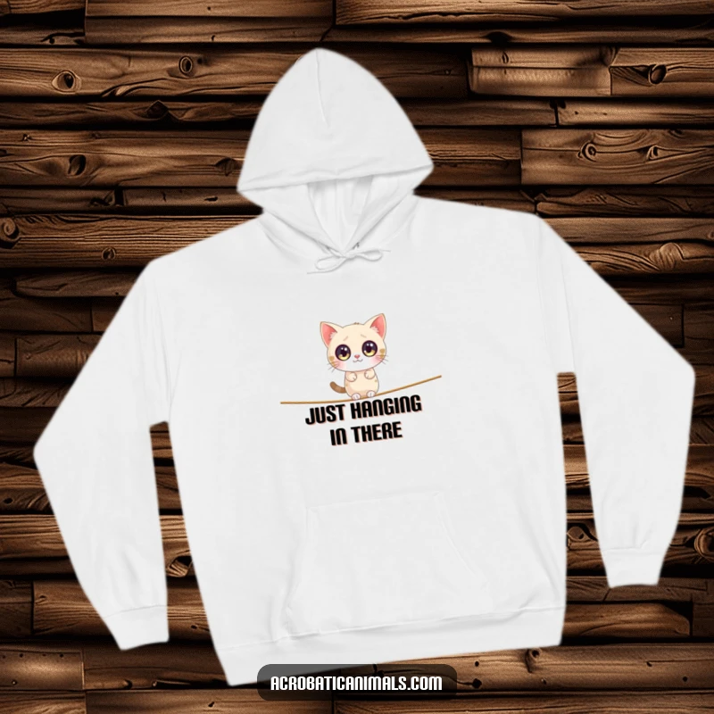 Funny cat hoodie showing a chubby cat with huge eyes balancing precariously on a minuscule tightrope, incredibly amusing.