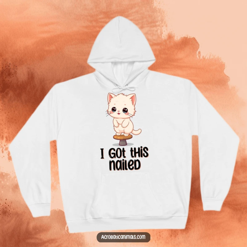 Funny Kitten Hoodie: A fluffy kitten balances precariously on a spinning beam, looking incredibly happy and cute.