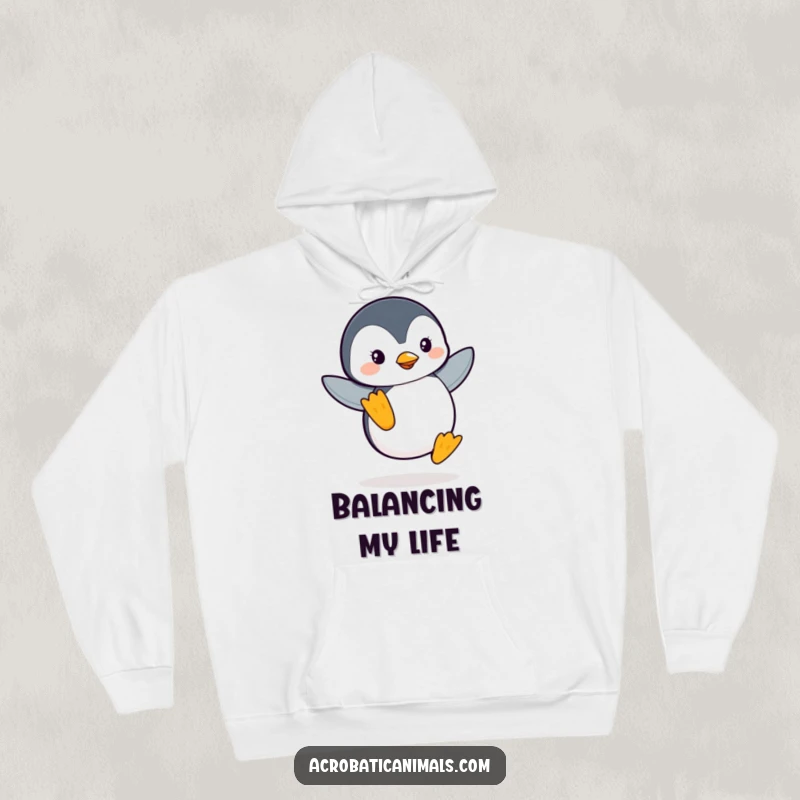 Funny Penguin Flipper Balance Hoodie: A cozy sweatshirt featuring a leaping penguin balancing on one flipper, designed for warmth and humor.