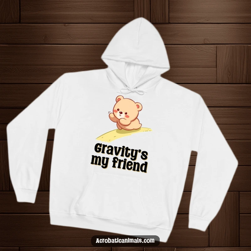 Funny hoodie depicting a bear cub tumbling down a slope, offering warmth and a touch of playful humor.