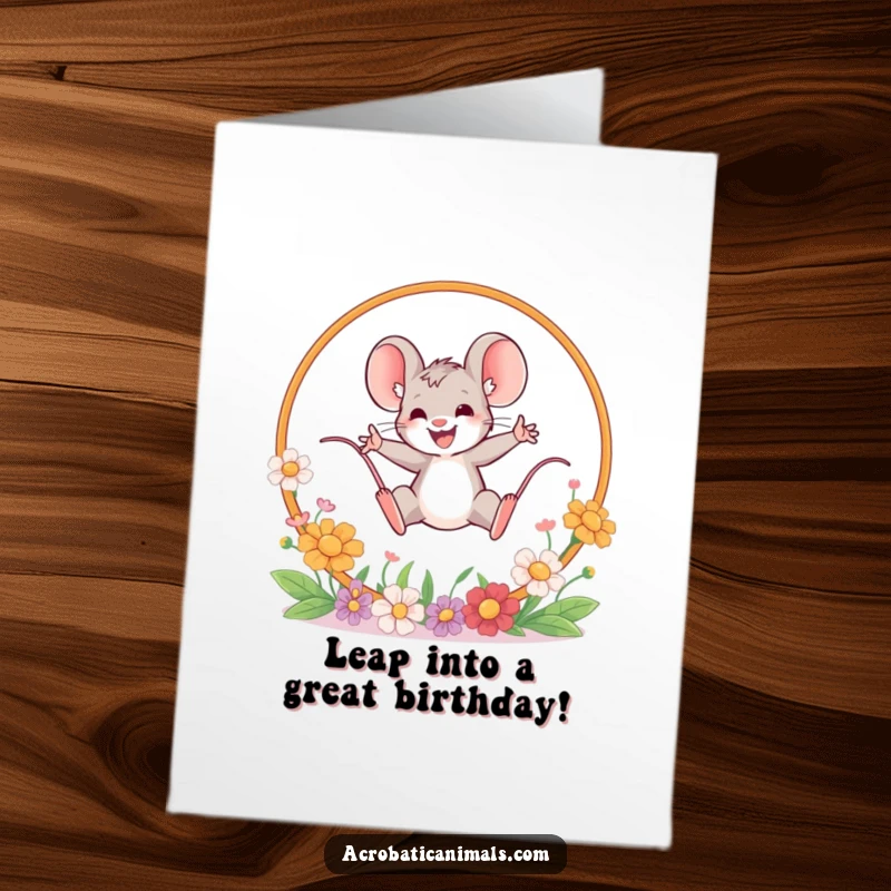 Funny Free Printable Birthday Card featuring a brave mouse leaping joyfully through a hoop adorned with vibrant flowers.