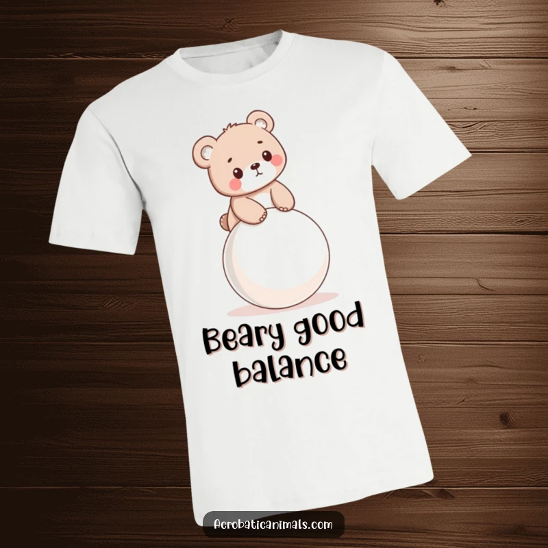 Funny t-shirt with a little bear cub mastering balance on a bouncy ball, capturing playful determination.